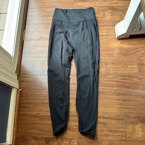 Black Lululemon leggings with sheer mesh on sides size 4